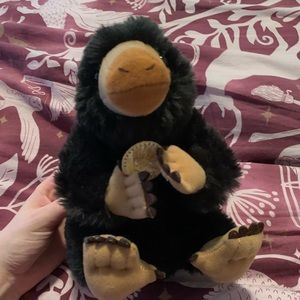 Niffler stuffed animal with coin